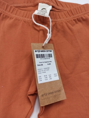 Pomarańczowe legginsy Musli